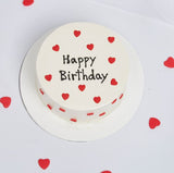 Mini Hearts Layer Cake On A White Background